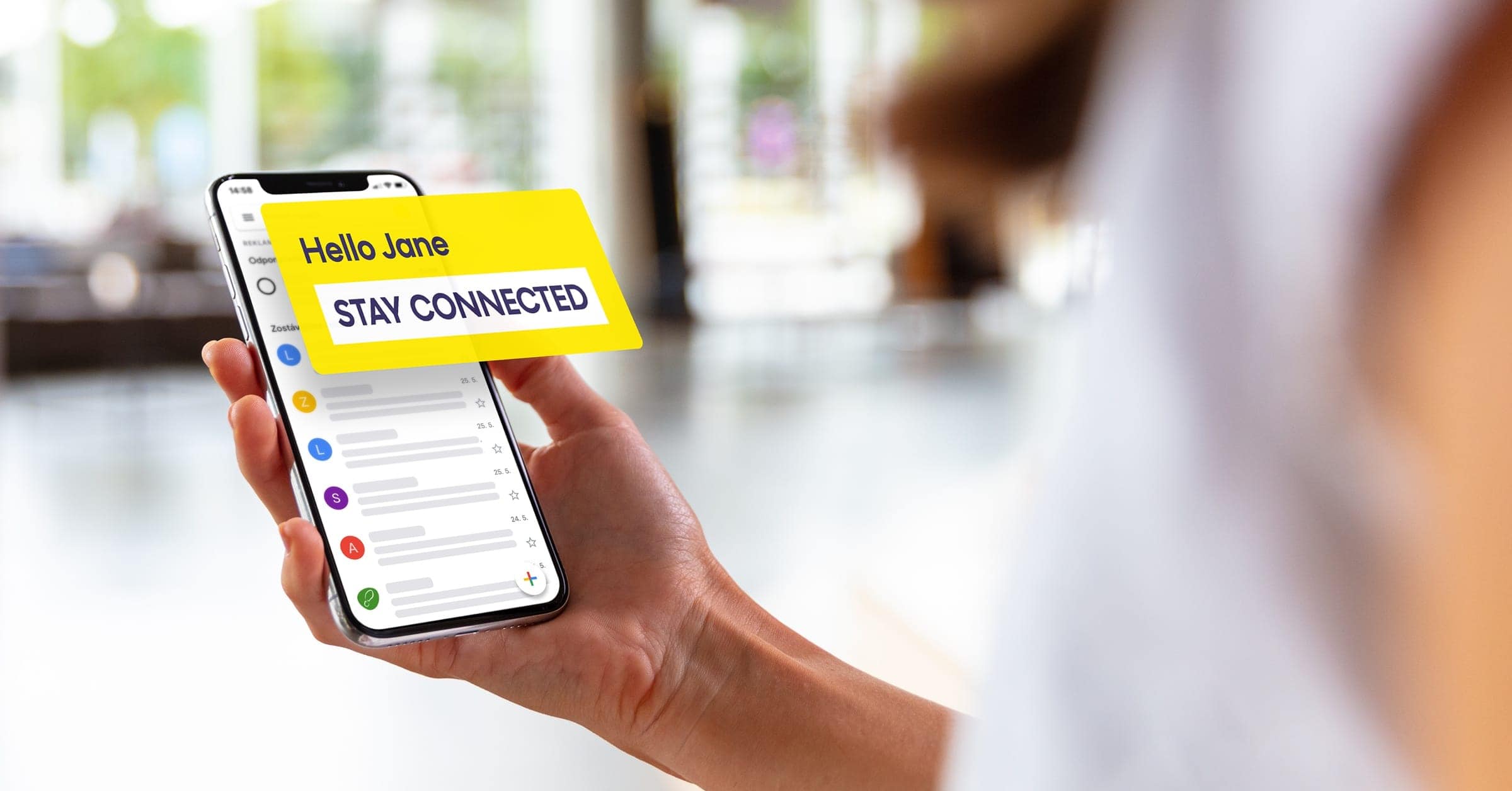 A customer receiving an automated welcome email on their phone.