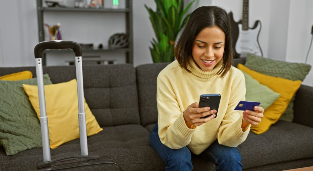 Person booking travel on a mobile device